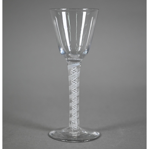 641 - A Georgian cordial glass with plain tapering bowl on opaque double-twist stem and flattened foot, 14... 