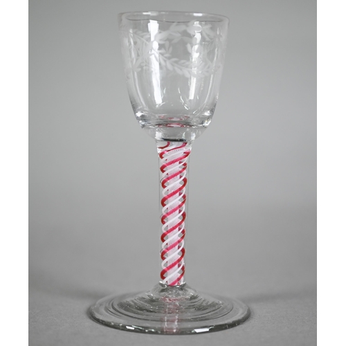 648 - A Georgian cordial glass cut with intertwined foliated guilloches, on red/white opaque triple-twist ... 