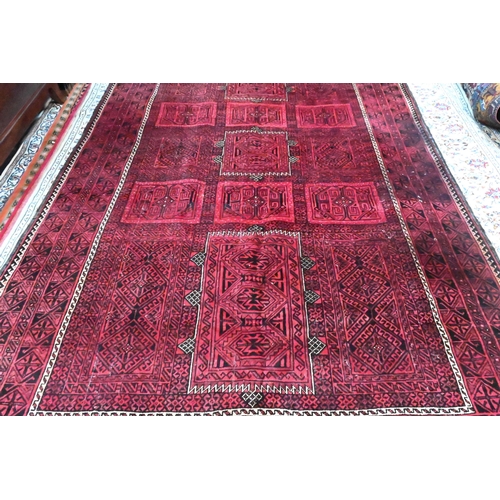 806 - A Persian Mashad, the overall tile design on red ground, 323 cm x 205 cm