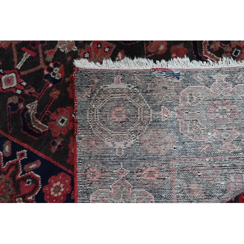 811 - A Persian blue ground Lilihan runner, the repeating geometric design on brown ground, 296 cm x 104 c... 