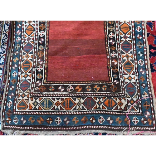 813 - An antique Persian Hamadan rust-red ground runner, the stylised boteh within multi-coloured borders,... 