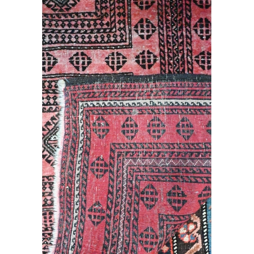 815 - An old Persian soft-red ground rug, 2nd quarter 20th century, 190 cm x 105 cm