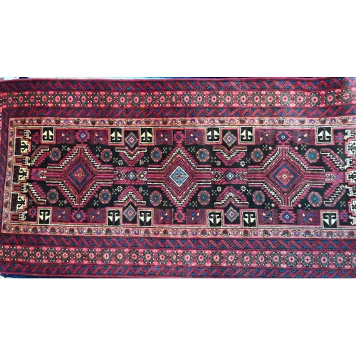 817 - A North East Persian Meshed Belouch design rug, with triple lozenge pole design, 1.90 cm x 0.85 m