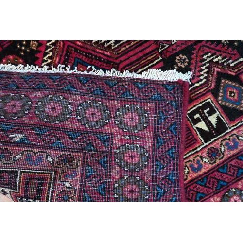 817 - A North East Persian Meshed Belouch design rug, with triple lozenge pole design, 1.90 cm x 0.85 m