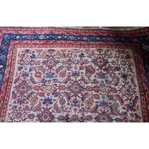 821 - An antique Persian Bakhshayesh carpet, the geometric all-over repeat design on camel ground, 530 cm ... 