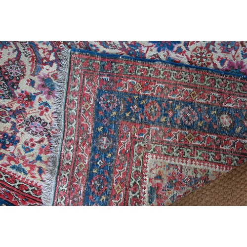 821 - An antique Persian Bakhshayesh carpet, the geometric all-over repeat design on camel ground, 530 cm ... 