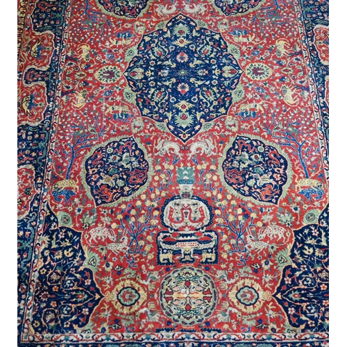 825 - A good fine antique Persian Kashan rug, the rust-red ground centred by a blue ground medallion, the ... 