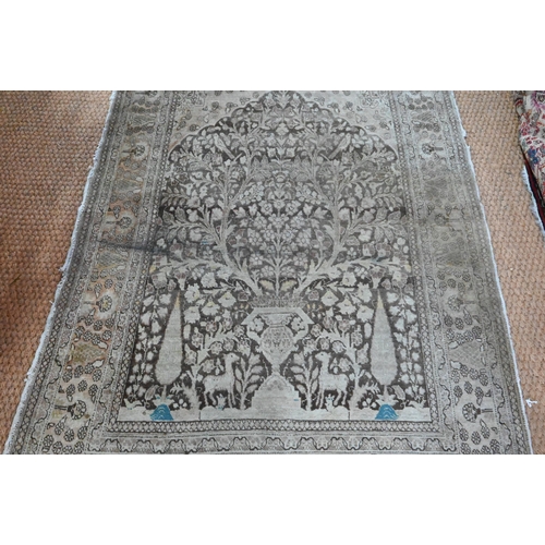 834 - A camel ground Persian Meshed rug, worn, low pile, 166 cm x 121 cm to/with a silk Indo-Persian kasha... 