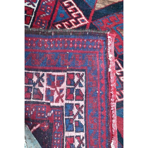 837 - A Persian blue/red ground geometric design rug, 258 cm x 166 cm