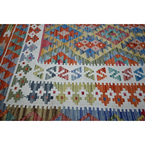 840 - An Anatolian kilim, multi-coloured diamond design, 178 cm x 128 m