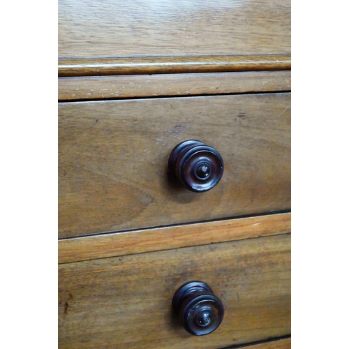 853 - A Victorian mahogany low open bookcase, centred by two long drawers over an open niche and pair cupb... 