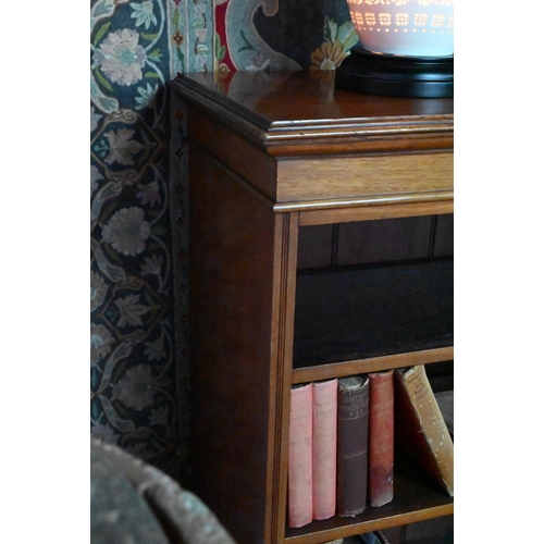 853 - A Victorian mahogany low open bookcase, centred by two long drawers over an open niche and pair cupb... 