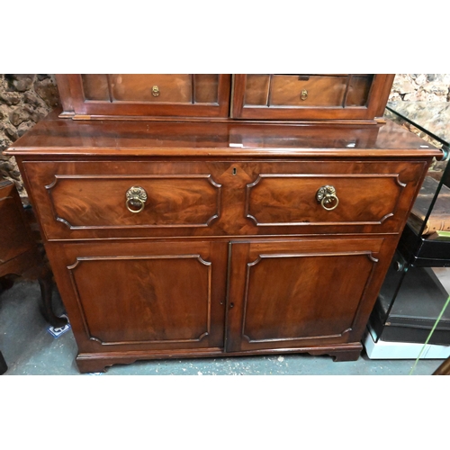 860 - A George III mahogany secretaire / bookcase, the (associated) astragal glazed upper part enclosing s... 