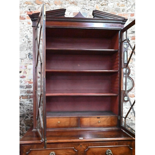 860 - A George III mahogany secretaire / bookcase, the (associated) astragal glazed upper part enclosing s... 