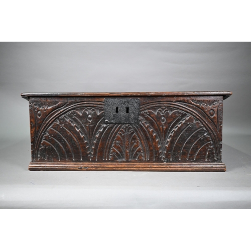 861 - A 17th century English oak bible box, lunette carved to front and sides, with iron lock-plate, 65 cm... 