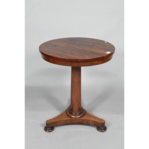 867 - A Victorian rosewood occasional table, the circular top raised on a tapering turned pillar to a tri-... 