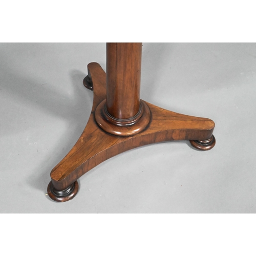 867 - A Victorian rosewood occasional table, the circular top raised on a tapering turned pillar to a tri-... 