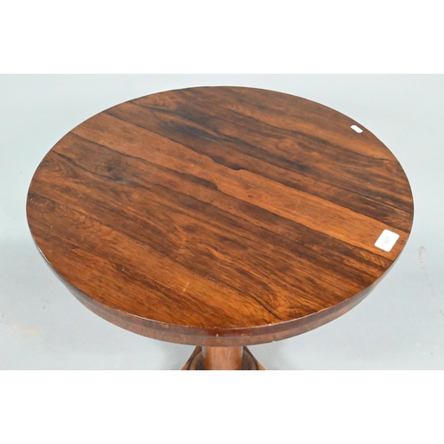 867 - A Victorian rosewood occasional table, the circular top raised on a tapering turned pillar to a tri-... 