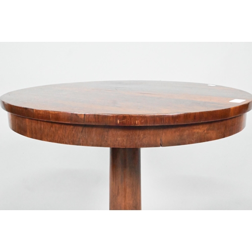 867 - A Victorian rosewood occasional table, the circular top raised on a tapering turned pillar to a tri-... 