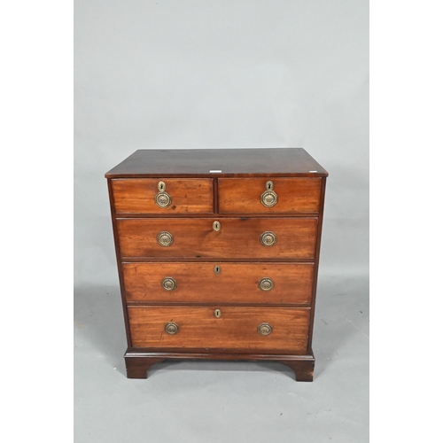 871 - A Georgian mahogany diminutive chest of two short over three long graduated drawers, raised on shape... 