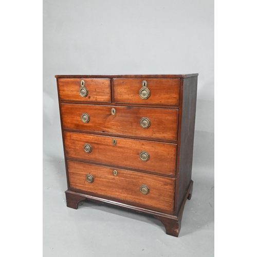 871 - A Georgian mahogany diminutive chest of two short over three long graduated drawers, raised on shape... 