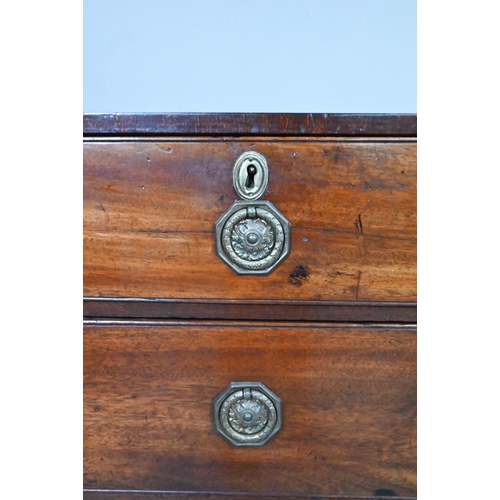 871 - A Georgian mahogany diminutive chest of two short over three long graduated drawers, raised on shape... 