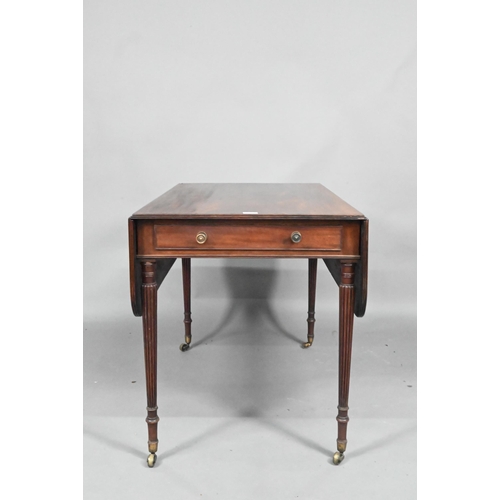 872 - A Regency mahogany drop leaf Pembroke table, the top with round corners and reeded edge, raised over... 