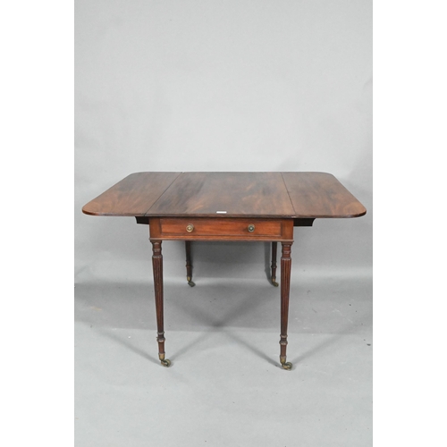 872 - A Regency mahogany drop leaf Pembroke table, the top with round corners and reeded edge, raised over... 