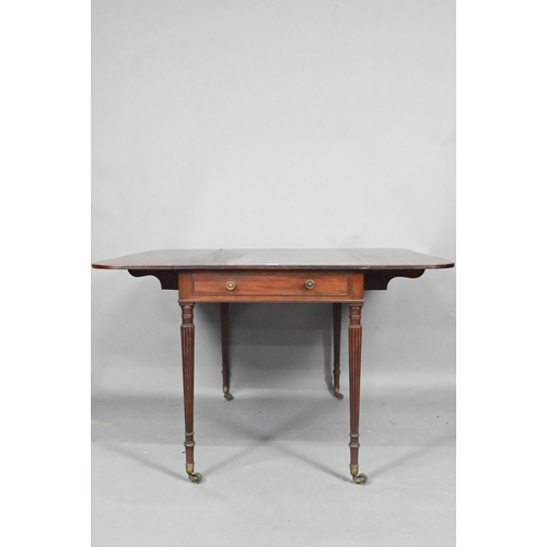 872 - A Regency mahogany drop leaf Pembroke table, the top with round corners and reeded edge, raised over... 