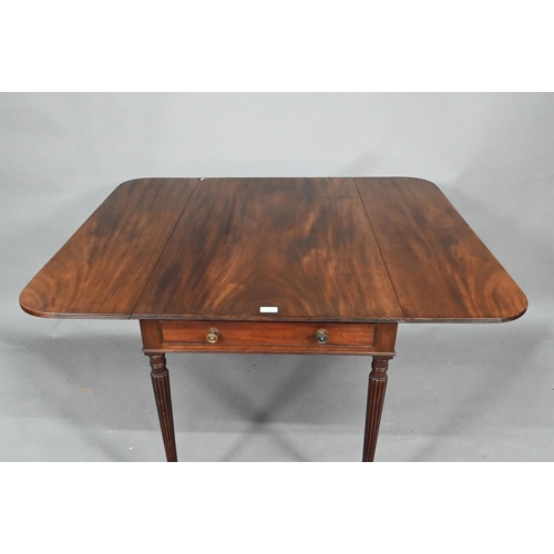 872 - A Regency mahogany drop leaf Pembroke table, the top with round corners and reeded edge, raised over... 