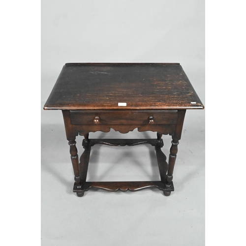 873 - A 17th century style provincial oak side table, with single frieze drawer, raised on turned legs uni... 