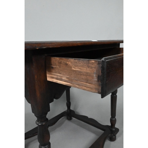 873 - A 17th century style provincial oak side table, with single frieze drawer, raised on turned legs uni... 