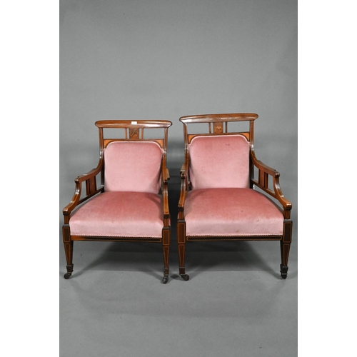 876 - Two companion Edwardian Sheraton Revival style satinwood inlaid rosewood salon armchairs, with confo... 