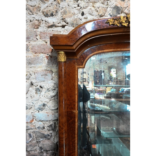 885 - A Biedermeier gilt metal mounted burr yew over-mantel mirror, the arched plate with bevelled edges f... 