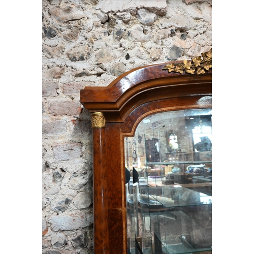 885 - A Biedermeier gilt metal mounted burr yew over-mantel mirror, the arched plate with bevelled edges f... 