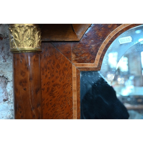 885 - A Biedermeier gilt metal mounted burr yew over-mantel mirror, the arched plate with bevelled edges f... 