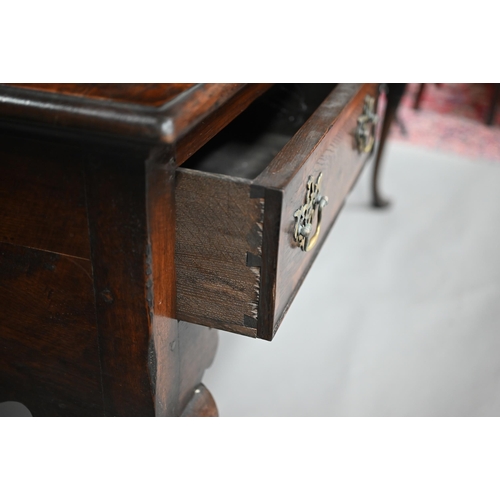 889 - An 18th century style oak high dresser, the rack with dentil moulted canopy centred by open shelves ... 