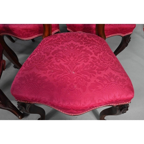 893 - A set of twelve Victorian mahogany style dining side chairs, with overstuffed crimson silk seats, ra... 