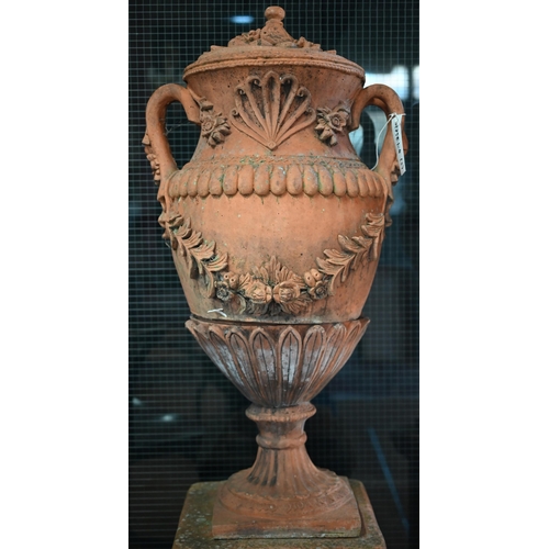 901 - A large pair of weathered classical cast terracotta lidded urns, with twin loop handles and decorate... 