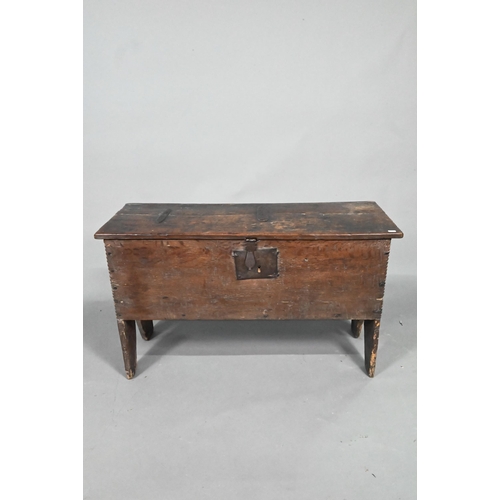 903 - A 17th century oak five-plank coffer, the top with chip carved edges and iron plate repairs over an ... 