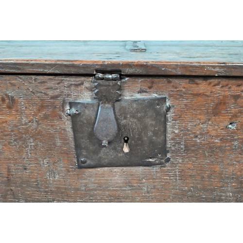 903 - A 17th century oak five-plank coffer, the top with chip carved edges and iron plate repairs over an ... 