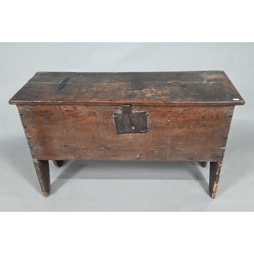 903 - A 17th century oak five-plank coffer, the top with chip carved edges and iron plate repairs over an ... 