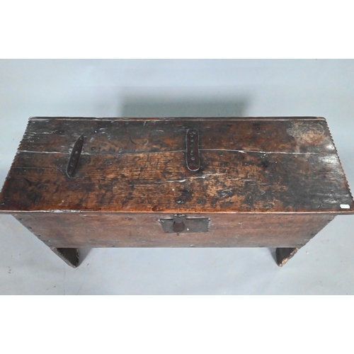 903 - A 17th century oak five-plank coffer, the top with chip carved edges and iron plate repairs over an ... 