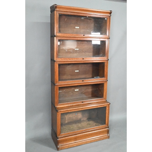 905 - A golden oak Globe Wernicke library bookcase, the four glazed sections over a single deep glazed bas... 