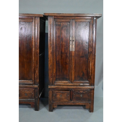 906 - A companion pair of Chinese Northern elm (Yumu) cabinets, late Qing, two doors over two drawers, 96 ... 