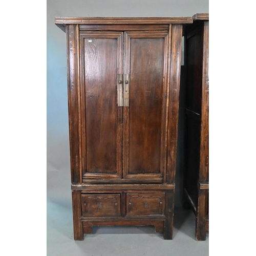 906 - A companion pair of Chinese Northern elm (Yumu) cabinets, late Qing, two doors over two drawers, 96 ... 