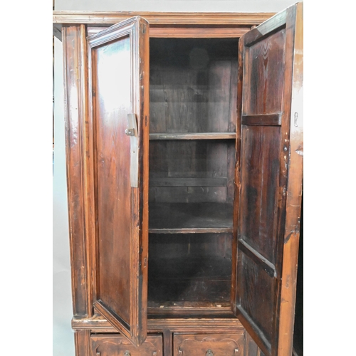 906 - A companion pair of Chinese Northern elm (Yumu) cabinets, late Qing, two doors over two drawers, 96 ... 