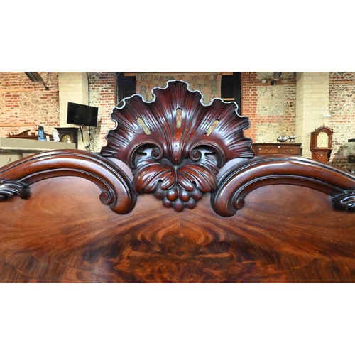 907 - A large Victorian mahogany country house twin pedestal sideboard, the heavily moulded back over a ce... 