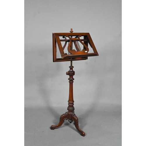 909 - A Victorian mahogany duet music stand, the adjustable lyre centred easels raised on a brass pole to ... 