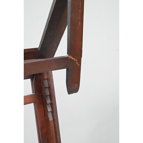 909 - A Victorian mahogany duet music stand, the adjustable lyre centred easels raised on a brass pole to ... 